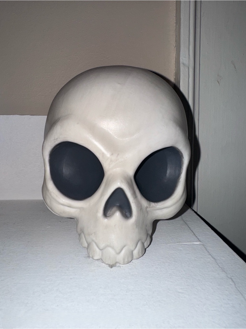 Plastic Skull Head Figurine in White with Black Eye Sockets